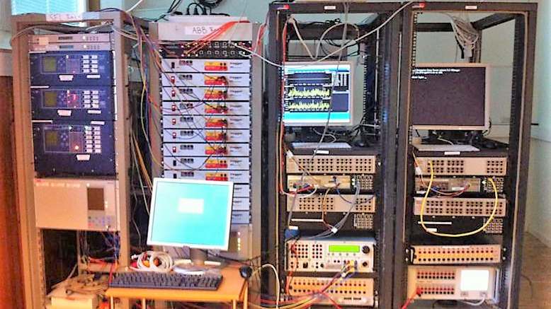 Real-time simulation facility including Opal-RT simulator, Megger amplifiers, SEL relays, and ABB relays